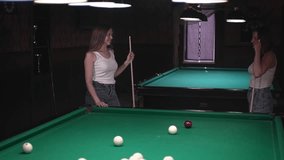 game of billiards. Russian billiards. two women in white t-shirts play billiards. real time video. High quality Full HD video recording