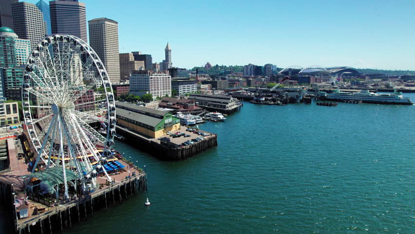 Seattle Waterfront Aerial with Tourist Attraction on Pier Royalty-Free Stock Footage #1105135775