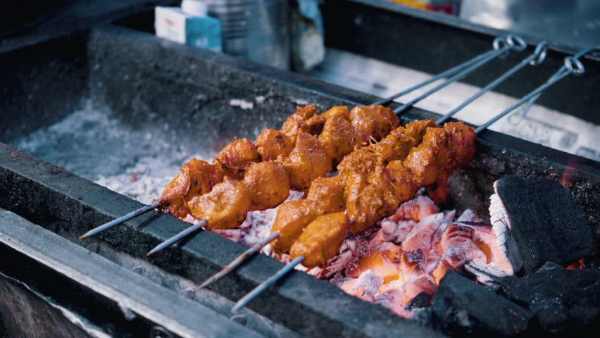 shashlik barbecue grill over charcoal at street stall, Mumbai city, India Royalty-Free Stock Footage #1105138581
