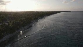 Aerial view of tropical beach landscape at Fuvahmulah island, a famous dive site for tiger sharks in South Maldives. Summer holiday and vacation travel concepts. 4K footage drone video