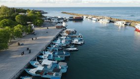 Aerial view of boat jetty at Fuvahmulah Harbour, fishing port and famous dive site for tiger sharks, Fuvahmulah Island, Gnaviyani Atoll or Nyaviyani Atoll, Maldives. 4K footage drone video