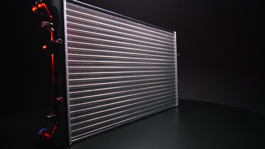 a new aluminum radiator for cooling antifreeze in the car engine Royalty-Free Stock Footage #1105154689