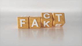 Abstract Fact to fake change concept. Transition with wooden cubes or blocks on white floor background. Fact checkers and fake news, true or false. Minimalist style. 3d buzzwords model animation. - Powered by Shutterstock - Get 15% off with code: PIKWIZARD15