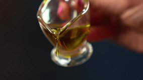 Slow motion olive oil pouring into glass bowl with green salad. Close up female hand pours oil into food. Woman cooking. healthy food. Chef cooking vegetarian meal. Organic healthy liquid oil flowing - Powered by Shutterstock - Get 15% off with code: PIKWIZARD15