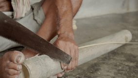 craftsman indian male cutting a bamboo stick making artisan product  - Powered by Shutterstock - Get 15% off with code: PIKWIZARD15
