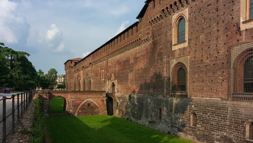 Entrance to the Sforzesco castle and its splendid medieval walls, Milan, Italy. Timelapse 30 fps