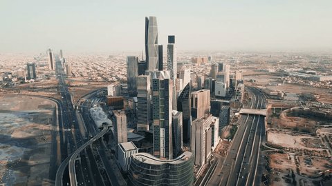 Drone video from above of the King Abdullah Financial District (KAFD) in the city of Riyadh, the financial city in the Kingdom of Saudi Arabia, the main destination for money and business in Riyadh: film stockowy