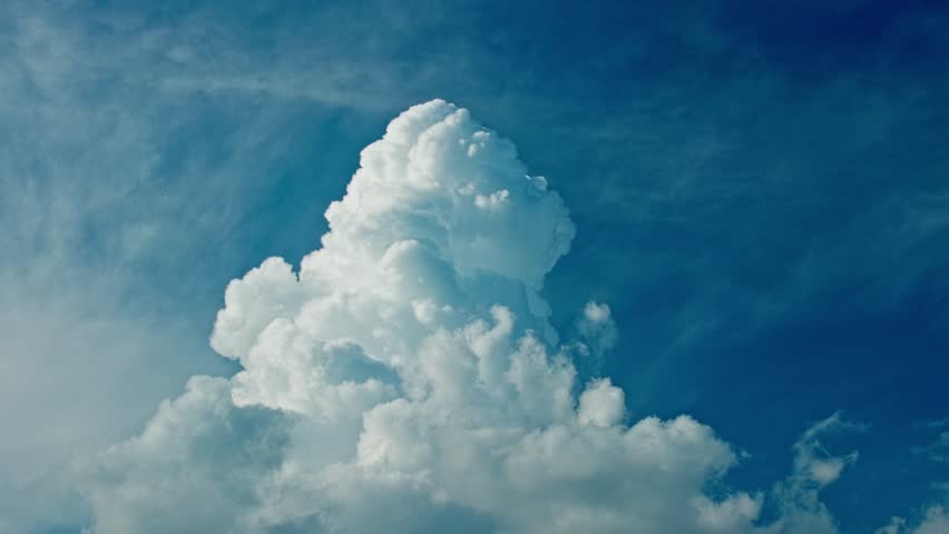 Amazing view of a cloud forming in a crystalline sky on a sunny day. Royalty-Free Stock Footage #1105183841