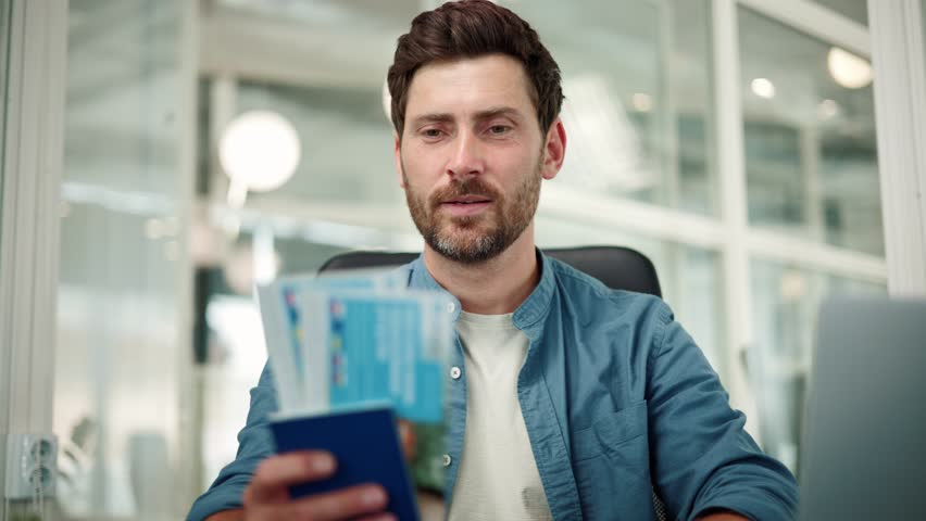 Happy excited office worker holds a passport with vacation tickets, looks into the camera, and enthusiastically shouts wow, last day of work in the office before going on vacation with their family. Royalty-Free Stock Footage #1105190255