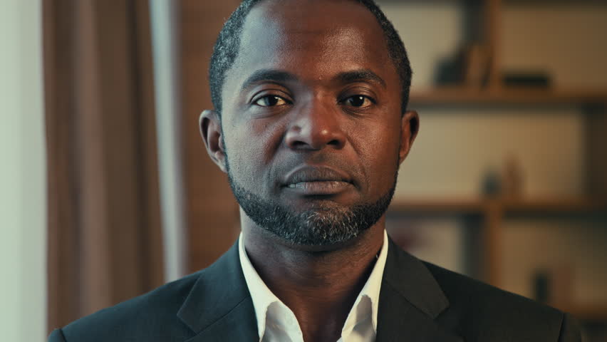 Headshot african american businessman looking at camera says no negative shakes head displeased frustrated man demonstrates disapproval bad result showing prohibition sign disapproves standing indoors Royalty-Free Stock Footage #1105195281