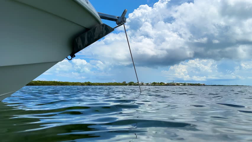 Water level view, anchored boat bow floating in ocean, Marathon, Florida Keys