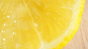 Captivating macro lemon: Close-up video captures a mesmerizing half lemon. Its peel shines, flesh bursts with citrus goodness, and fragrance invigorates. Detailed shots unveil pulp, seeds. 4K HDR
