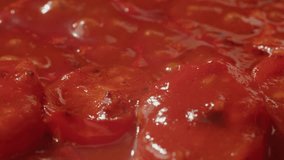 Fresh cherry tomatoes in a frying pan with olive oil and spices. Cooking tomato sauce. Traditional Italian Mexican Asian dish. High quality studio shot for cafe, restaurant close up. - Powered by Shutterstock - Get 15% off with code: PIKWIZARD15