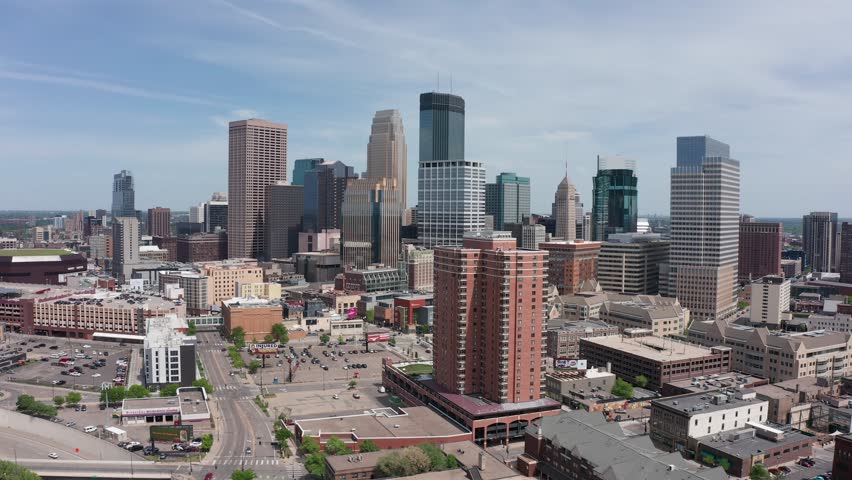 Rising aerial panning shot of downtown Minneapolis, Minnesota. 4K Royalty-Free Stock Footage #1105202601