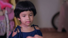 This video is about  A young kid looks sadly at her mother as she refuses to take medicine