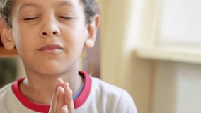 little boy praying to God with hands together on white background with people stock video stock footage