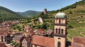 Aerial Drone Shot of the Church in Kaysersberg in Alsace in a day. Summer in France, Castle and a beautiful City