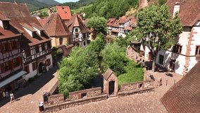 Aerial Drone Shot of the river in village of Kaysersberg in Alsace in a day. Summer in France, Cute French Village