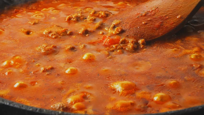 .The thick bolognese sauce boils and gurgles in the pan Medium plan Royalty-Free Stock Footage #1105209039
