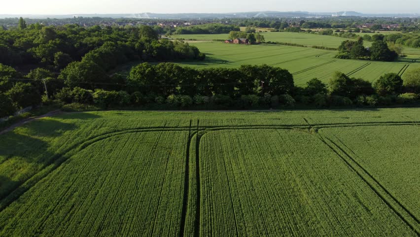 Aerial drone shot of the beautiful field at cronton village united kingdom with view of trees and the beautiful landscape