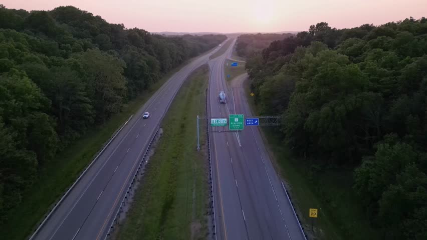 Illinois state board sign. highway road at sunset