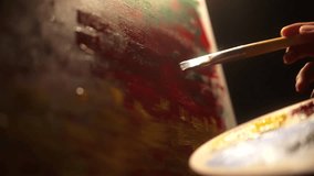 
Close-up Moving Paint brush holding on hand of artist and painting on canvas work art with color oil painting at dark room workshop. Artist works and Creative on Abstract Oil Painting at night.
 - Powered by Shutterstock - Get 15% off with code: PIKWIZARD15