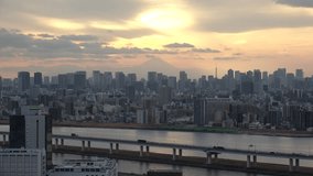 TOKYO, JAPAN : Aerial sunset view of CITYSCAPE of TOKYO and Mount Fuji. Buildings at central downtown area. Japanese urban metropolis and nature concept video. 4K Time lapse shot, dusk to night.