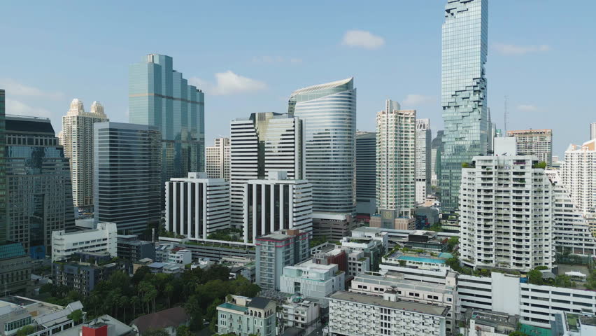 Aerial view of Bangkok Downtown Skyline, Thailand. Financial district and business centers in smart urban city in Asia. Skyscraper and high-rise buildings at sunset.