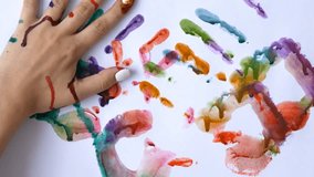 Handprint Art - Creative Concept of Man and Woman Making Painted Handprints on White Background for Artistic Expression and Memories - Powered by Shutterstock - Get 15% off with code: PIKWIZARD15