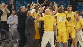 Happy Diverse Sports Team Winning Basketball Association Playoffs: Group of Players, Coaches, Managers, Friends and Fans Celebrate the Victory on Live Sports Broadcast Television Channel - Powered by Shutterstock - Get 15% off with code: PIKWIZARD15