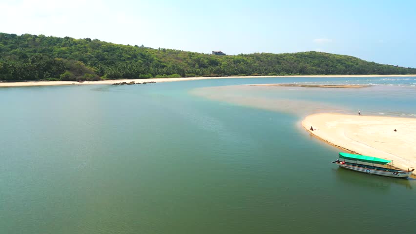 Devbag Beach drone moving closer to river in Malvan