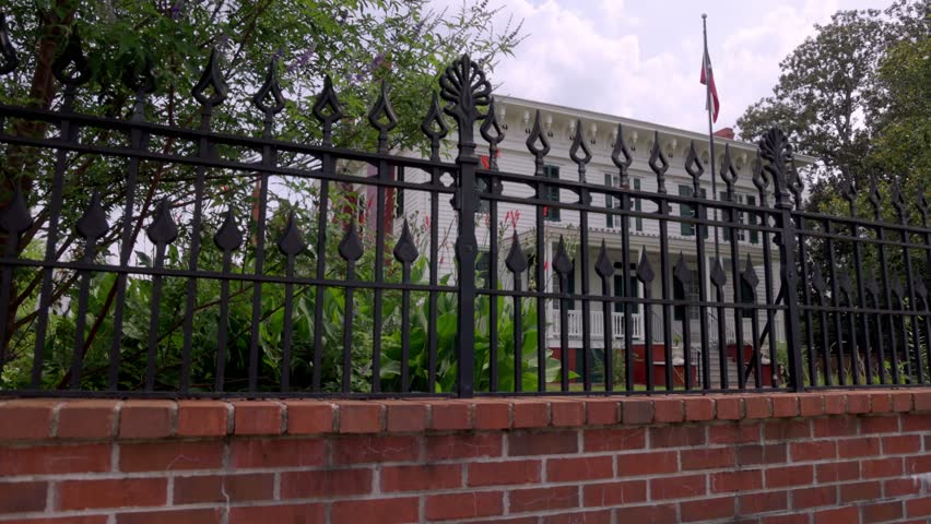 The First White House of the Confederacy in Montgomery, Alabama with gimbal video walking along fence.