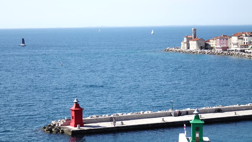 Panorama   of the sea, sailing yachts and the old city on the shore of the bay and harbor on a summer sunny day, the background