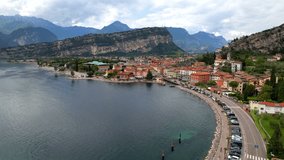 Scenic Garda lake, popular beautiful town and resort Torbole. aerial drone overflight 4k video. Trentino, Lago di Garda, Italy