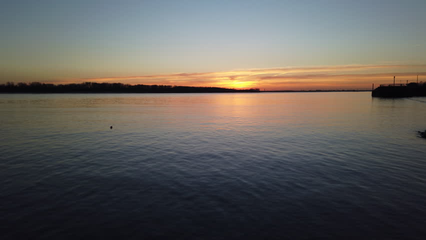 Elbe River at sundown with calm water surface