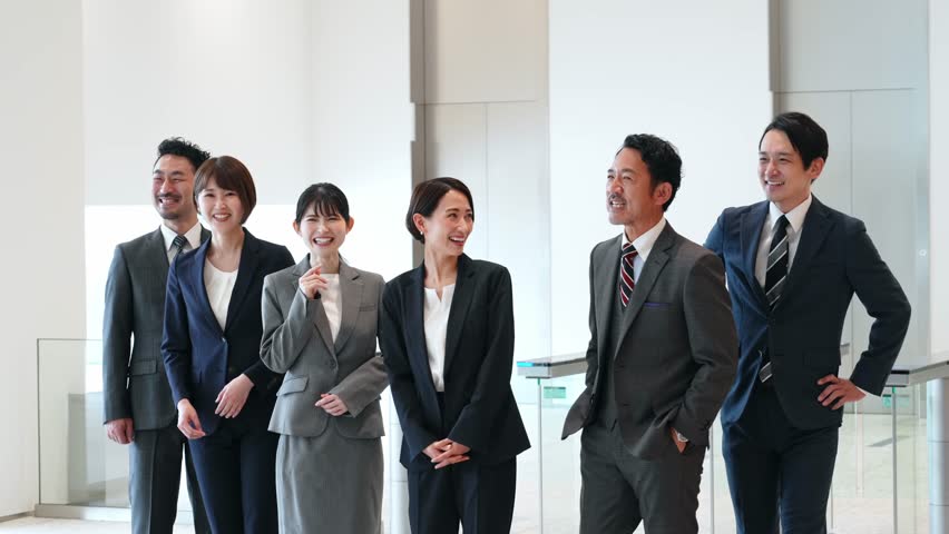 Group of various generation Asian businesspeople meeting in lobby. Office workers discussing for success. Royalty-Free Stock Footage #1105258937