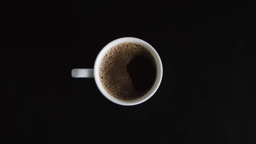 woman hand turning coffee cup