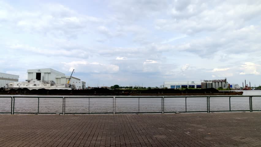 Barge moving in Mobile Bay in Mobile, Alabama with stable video.