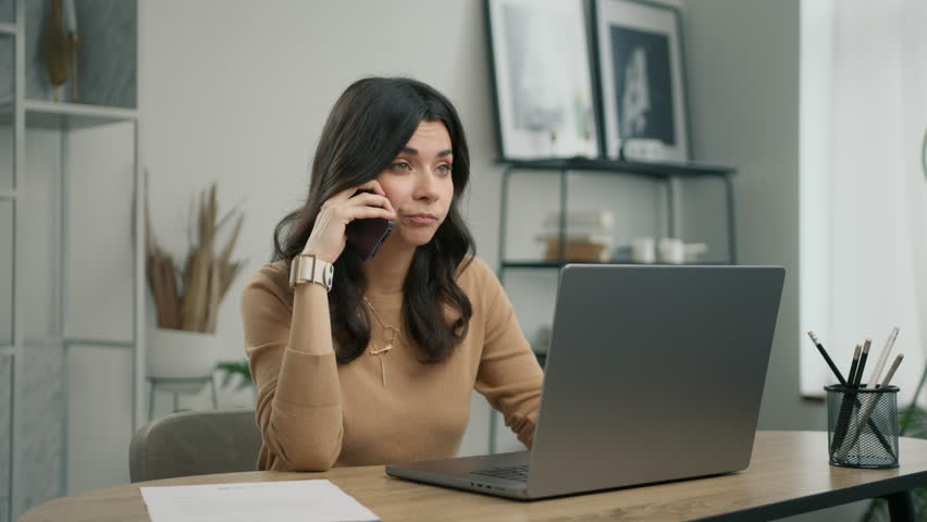 Unhappy stressed female mobile user hearing bad news at mobile chat 4K. Portrait of displeased young hispanic woman looking at laptop screen, dissatisfied with bad news message during smartphone call Royalty-Free Stock Footage #1105261987