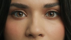 Attractive brunette girl opening Beautiful hazelnut brown eyes. Natural Beauty with healthy skin. Gorgeous woman with long Eyelashes and Attractive Appearance slow motion. Close up Latino Woman Face - Powered by Shutterstock - Get 15% off with code: PIKWIZARD15