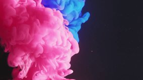 Vertical video. Paint water drop. Color fluid mix. Underwater splash. Vibrant neon pink blue glitter vapor cloud blend motion on dark abstract art background. - Powered by Shutterstock - Get 15% off with code: PIKWIZARD15