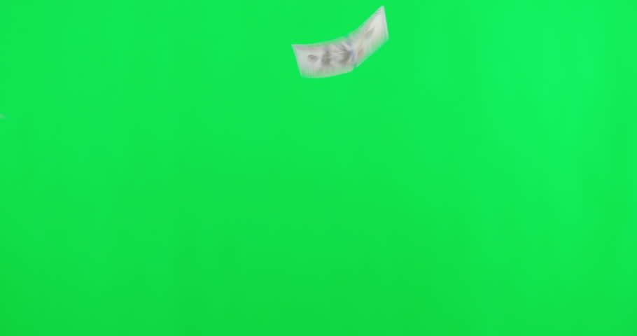 Green screen, finance and cash falling, bills and savings against a studio background. Prize, giveaway or competition with financial, money or inflation with economy, dollar or investment with profit Royalty-Free Stock Footage #1105265611