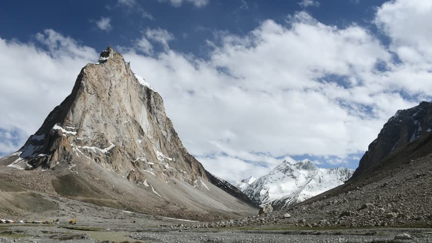 Time lapse at mountain Gonbo Rangjon  which is a stand-alone lofty rocky precipice located south of Kargyak village in the Lungnak valley, Zanskar, Ladakh, India.  It is considered to be holy mountain