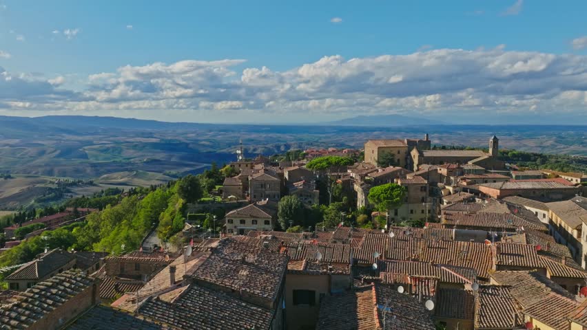 Aerial over the walled town of Volterra, Province of Pisa, Italy. Drone dolly forward shot Royalty-Free Stock Footage #1105283193