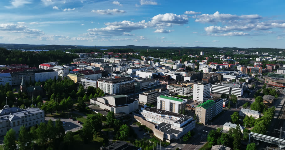 Aerial tracking shot of downtown of Jyvaskyla city, sunny summer day in Finland