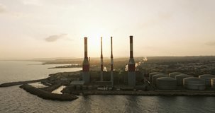 In the Grip of Pollution: A Gripping Aerial Cinematic Encounter Exposing the Hazards of Power Plant Emissions on Our Air Quality. High quality 4k footage