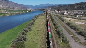 River's Cargo Journey: A Train Ride Along the Thompson River in Kamloops