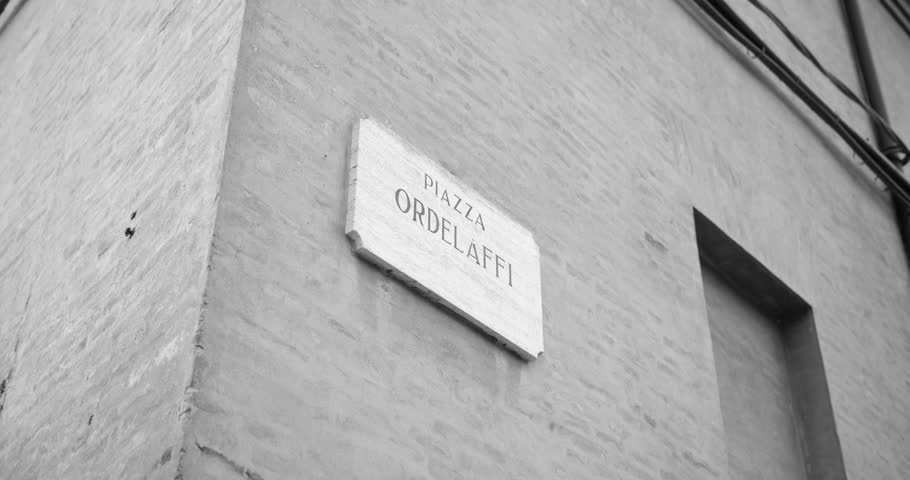 Shot of writing Piazza ordelaffi on wall, Forli, Italy_4K
