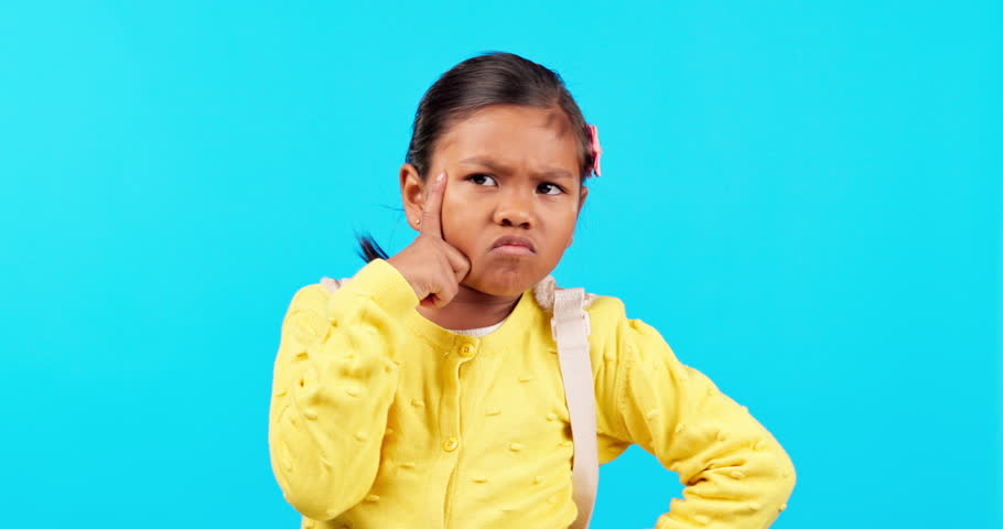 Thinking, confused and girl child in studio with question, why and choice against blue background. Doubt, solution and kid student with decision, emoji and plan for back to school problem solving Royalty-Free Stock Footage #1105301673