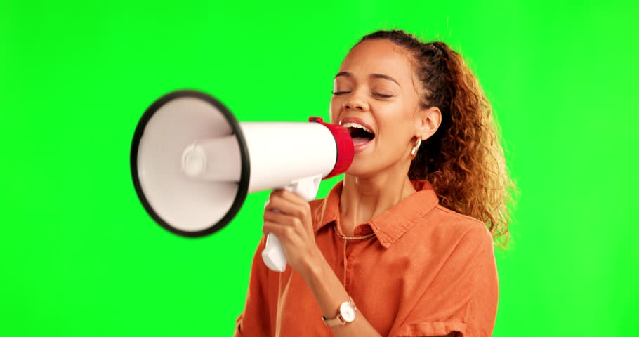 Happy woman, megaphone and shouting on green screen for winning or announcement against a studio background. Excited female person screaming voice for speech, achievement or success in motivation Royalty-Free Stock Footage #1105301859